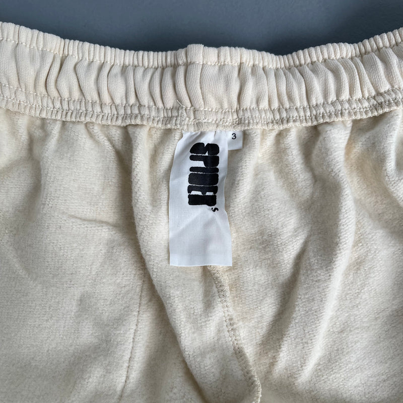 SP5DER Sand Beige Pants – Designer Streetwear with Graphic Details