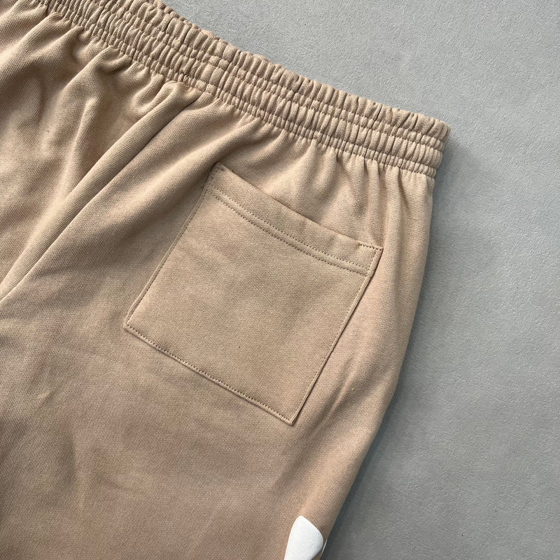 SP5DER Sand Beluga Pants – Neutral Streetwear Designer with Graphic Details