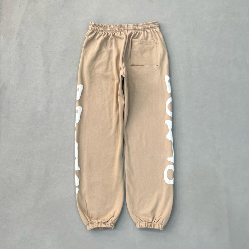 SP5DER Sand Beluga Pants – Neutral Streetwear Designer with Graphic Details