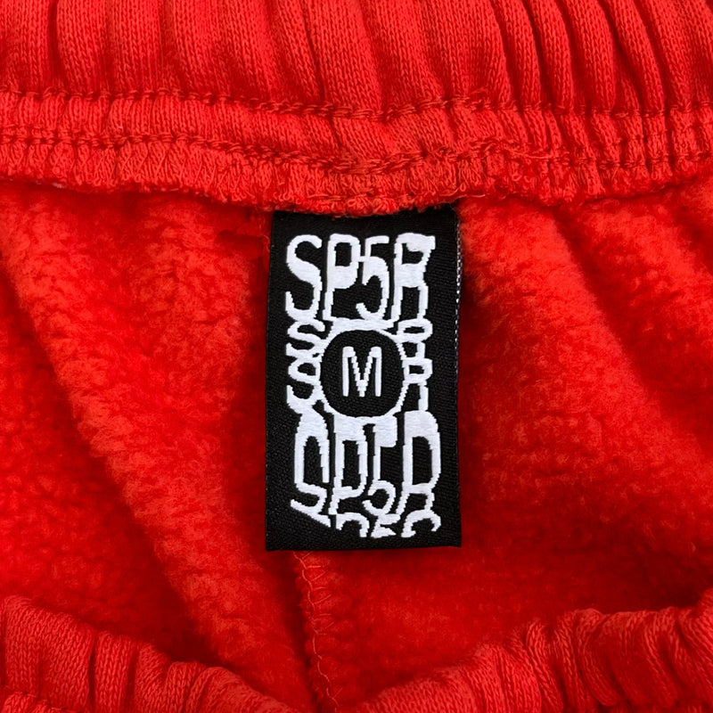 SP5DER Red Pants – Bold Streetwear with Graphic Design